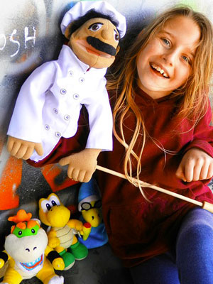 young girl with puppets