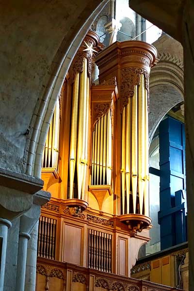 theater organ pipes in church gold colored