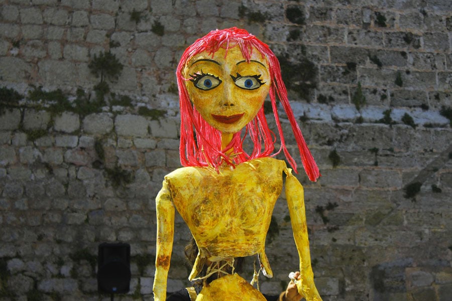 yellow puppet girl with pink hair