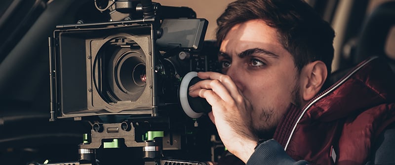 Man filming with big camera