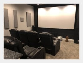 basement movie room with 2 rows of seating