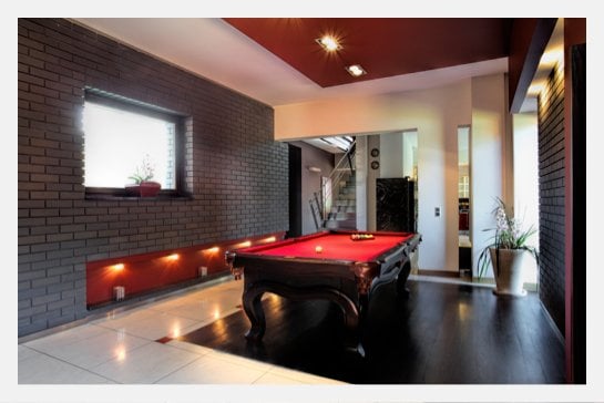 basement pool table with red felt