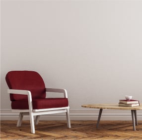 red single armchair beige wall