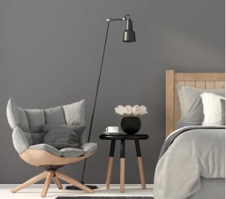 grey cushioned spin chair in bedroom