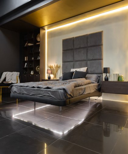grey bedroom with lights behind