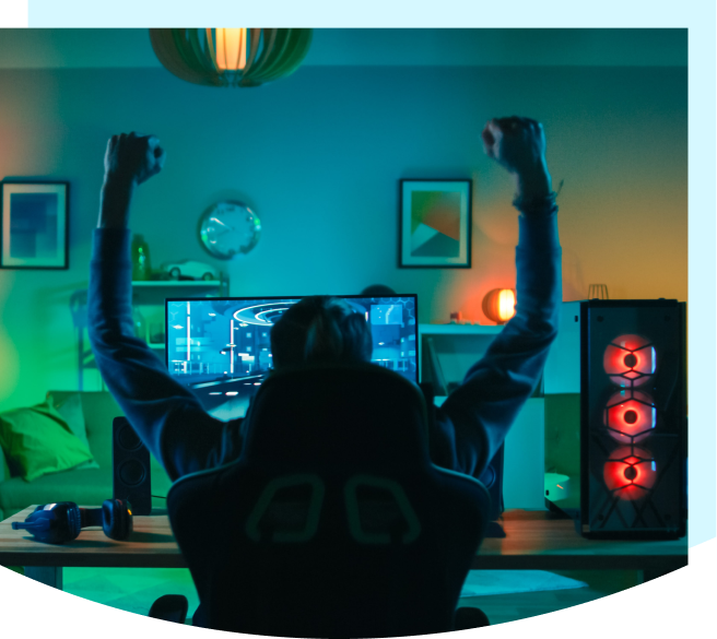 video game player cheering at computer