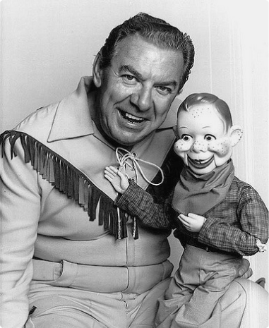 black and white man with puppet