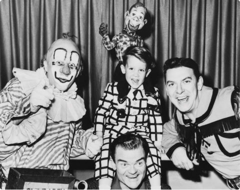 Clown with family and puppets